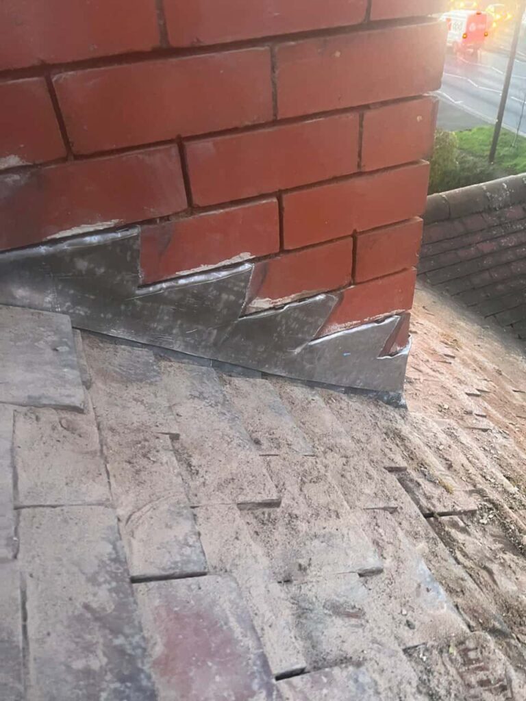 This is a photo of new leadwork being installed around an old chimney. Works carried out by LJ Roofing Royal Wootton Bassett